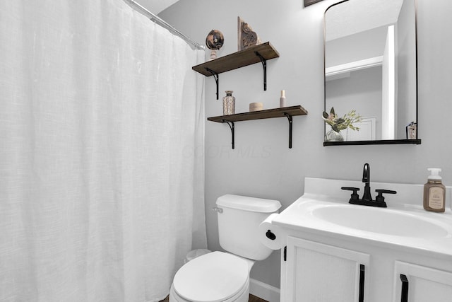 full bathroom with vanity and toilet