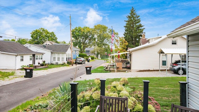 view of yard featuring a residential view and fence