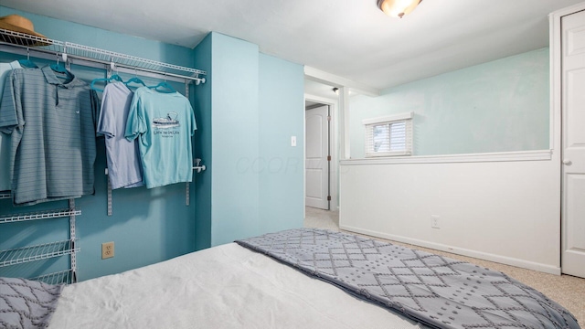 carpeted bedroom with baseboards