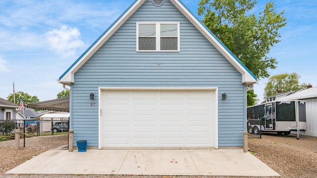 garage with fence