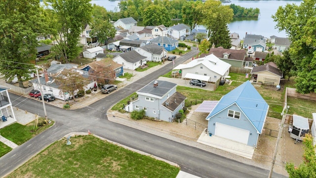 bird's eye view featuring a water view and a residential view