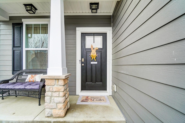 property entrance featuring covered porch