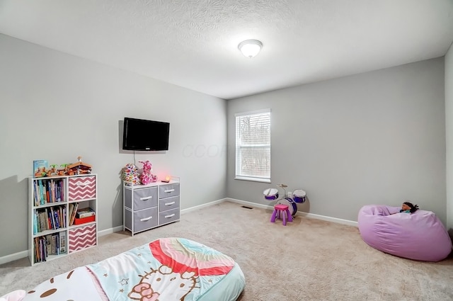 rec room featuring carpet floors and baseboards