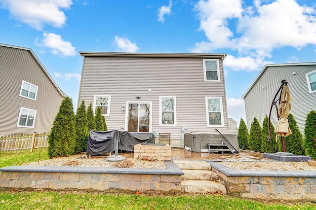 rear view of property with fence