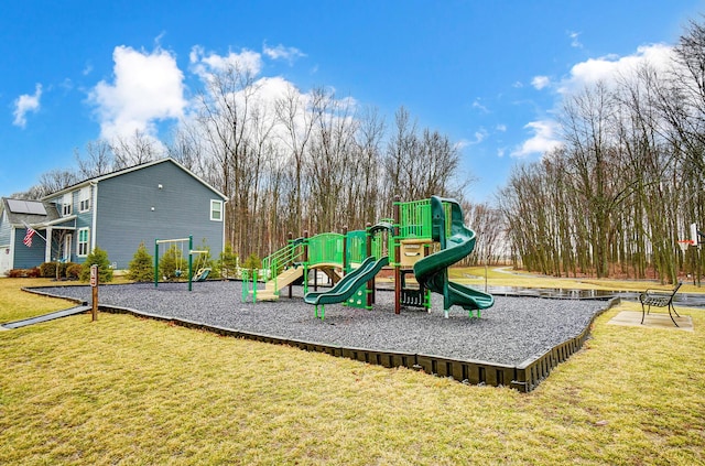 communal playground featuring a yard