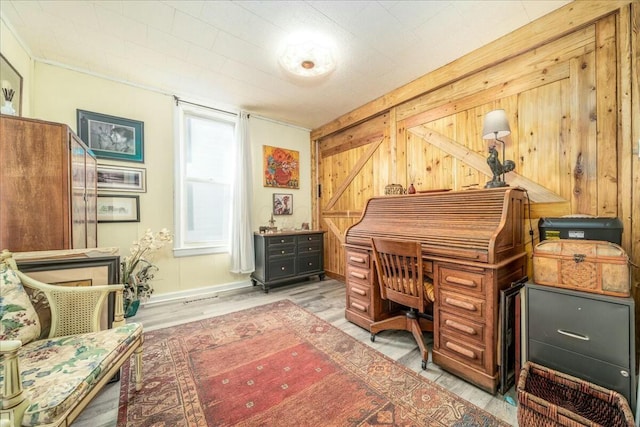 office space with wooden walls and wood finished floors