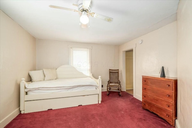 carpeted bedroom with baseboards and a ceiling fan