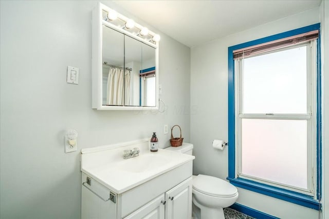 full bath with vanity and toilet