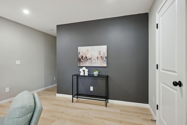 details featuring wood finished floors and baseboards