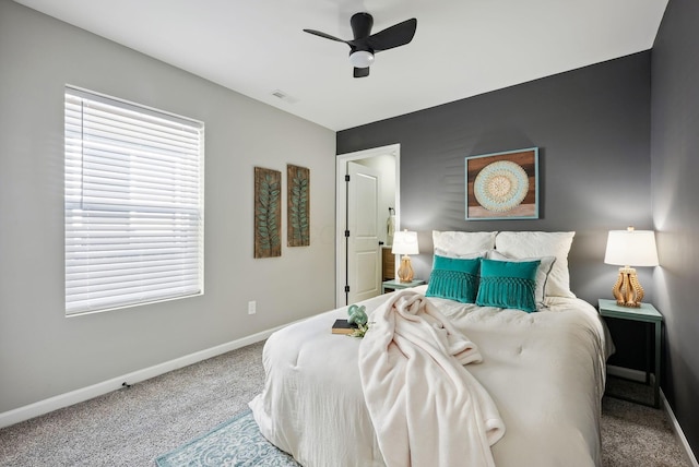 bedroom featuring carpet flooring, visible vents, ceiling fan, and baseboards