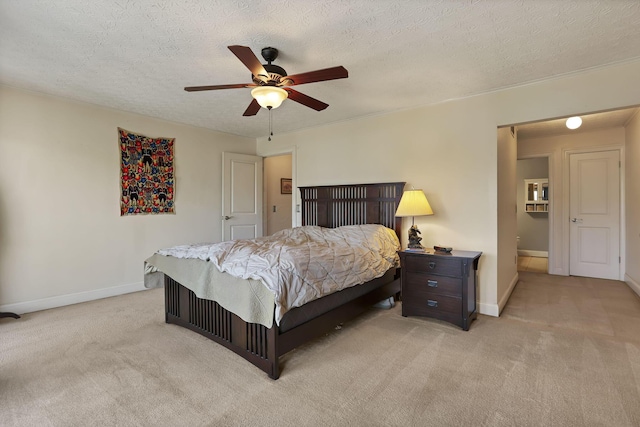 bedroom with light carpet, ceiling fan, a textured ceiling, and baseboards