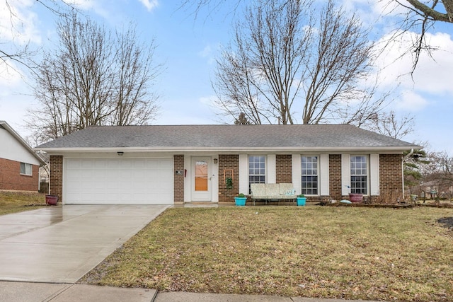 single story home with brick siding, roof with shingles, concrete driveway, an attached garage, and a front yard