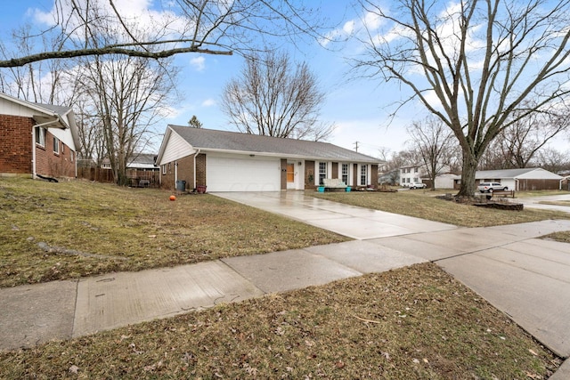 view of front of property with a garage, a front yard, brick siding, and driveway