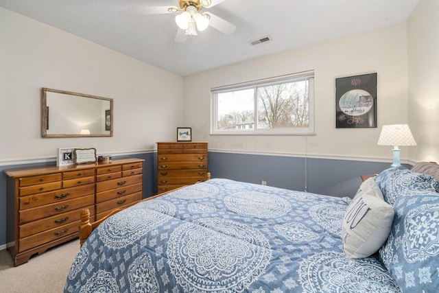 bedroom with ceiling fan, carpet, and visible vents