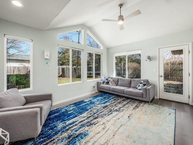 sunroom / solarium with ceiling fan and lofted ceiling