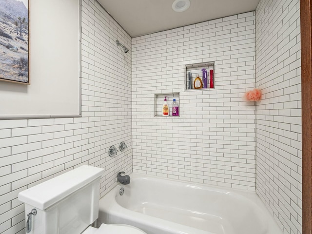 full bath featuring tile walls, toilet, and shower / bathtub combination