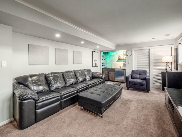 living room with baseboards, carpet floors, recessed lighting, ornamental molding, and indoor bar