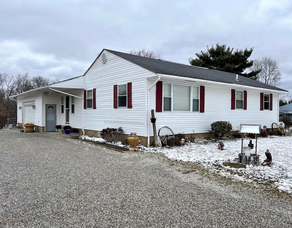 ranch-style home featuring an attached garage