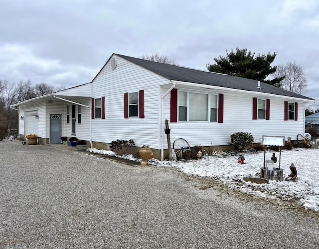 ranch-style home featuring an attached garage