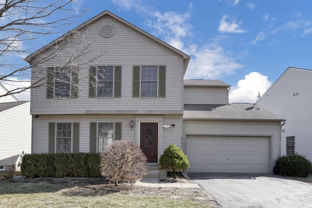 view of front of property with concrete driveway and an attached garage