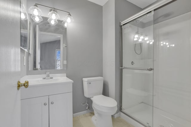 full bath featuring baseboards, vanity, toilet, and a shower stall