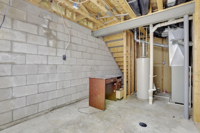 unfinished below grade area with concrete block wall and water heater