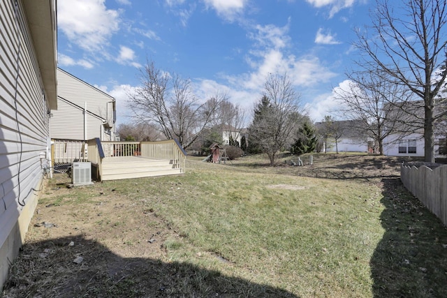 view of yard with a wooden deck and fence