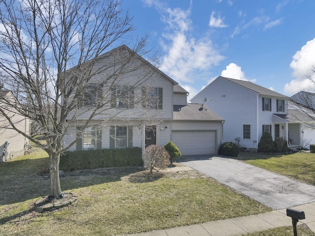 view of front of home with a front yard, a garage, and driveway