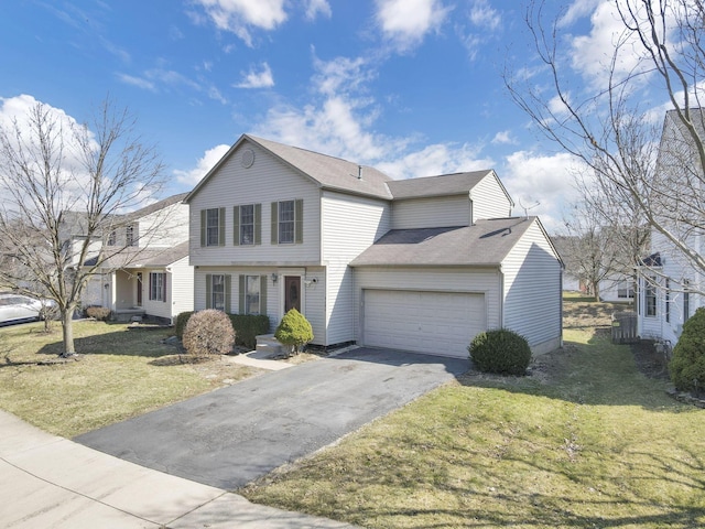 colonial-style house with aphalt driveway, an attached garage, and a front lawn