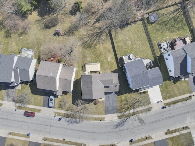 birds eye view of property with a residential view