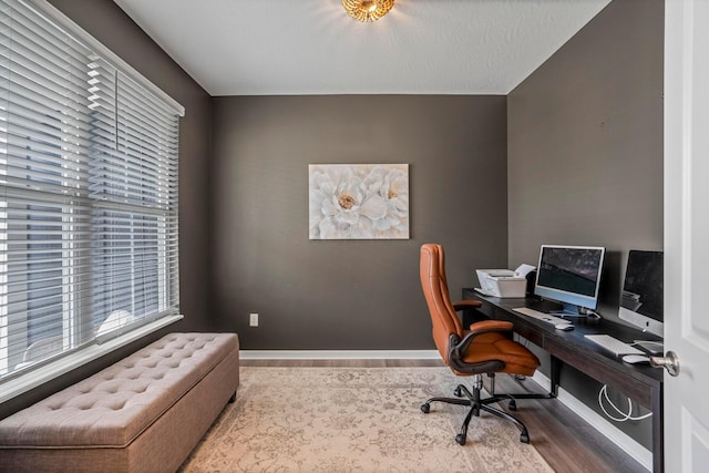 office featuring wood finished floors and baseboards