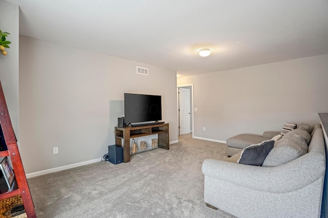 living area with light colored carpet, visible vents, and baseboards