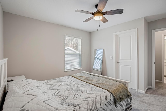 bedroom with baseboards, light carpet, and ceiling fan