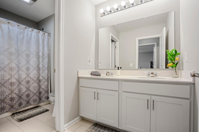 full bath featuring tile patterned floors, toilet, a sink, curtained shower, and double vanity