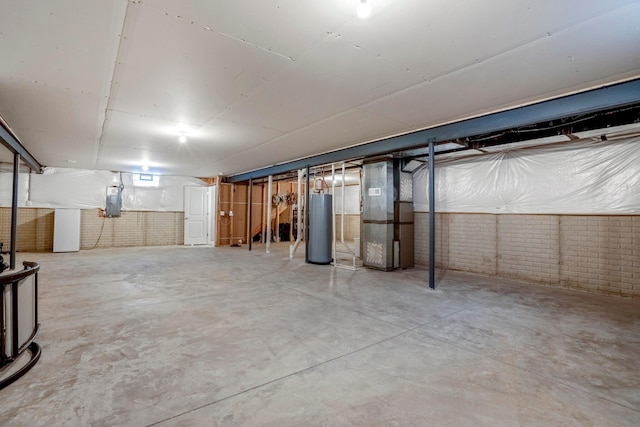 unfinished basement with electric panel, heating unit, brick wall, and water heater