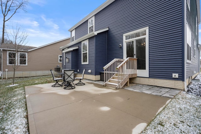 view of patio / terrace with central air condition unit and outdoor dining space