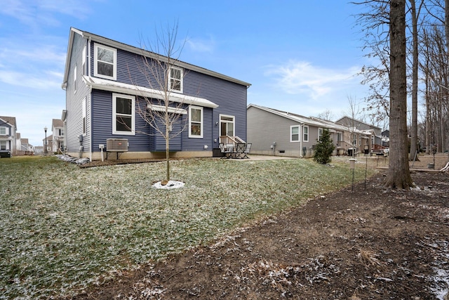 back of property featuring a yard and cooling unit