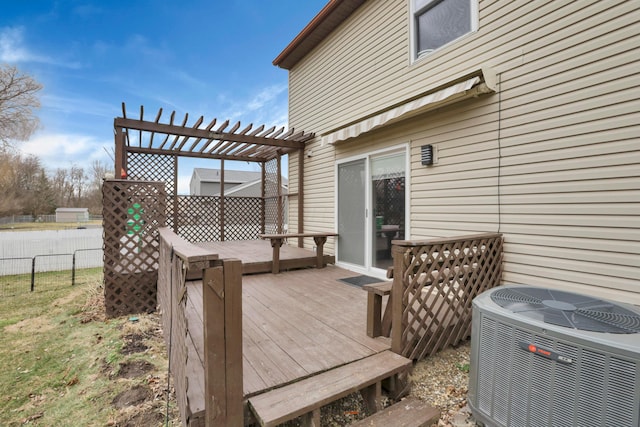 wooden deck with central air condition unit, fence, and a pergola