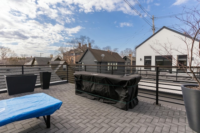 view of patio with a balcony and a grill