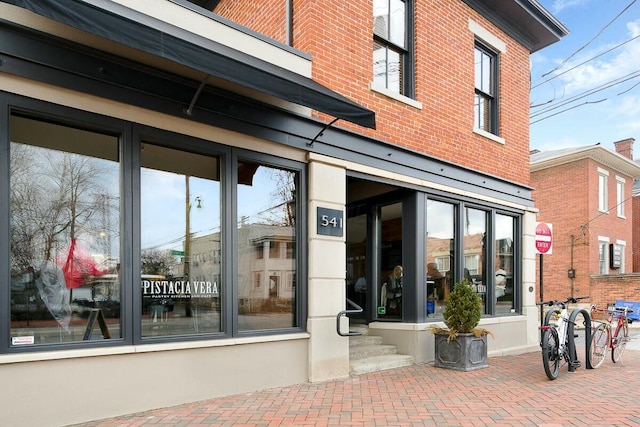 entrance to property with brick siding