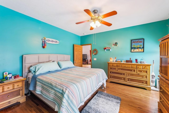 bedroom featuring ceiling fan and wood finished floors