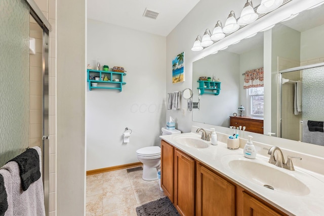 full bath featuring visible vents, a sink, and a shower stall