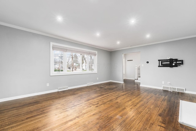 unfurnished living room with wood-type flooring, visible vents, and crown molding