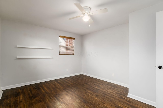 unfurnished room featuring ceiling fan, baseboards, and dark wood-style flooring