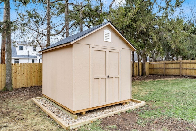 view of shed featuring a fenced backyard