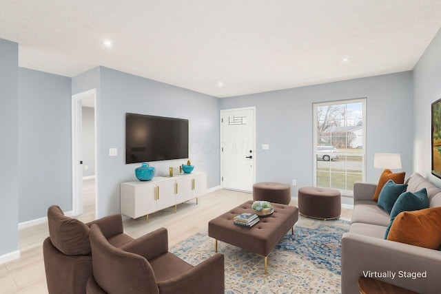 living room featuring light wood-style floors, recessed lighting, and baseboards