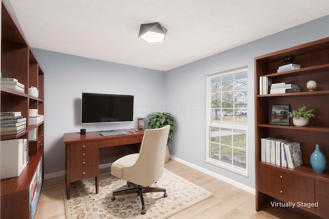 home office featuring light wood-type flooring and baseboards