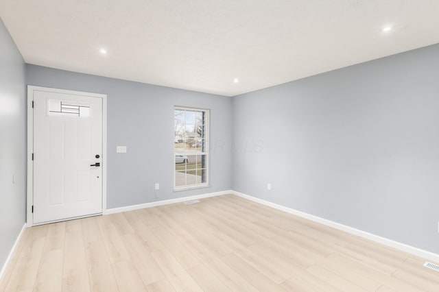 interior space featuring recessed lighting, light wood-type flooring, and baseboards