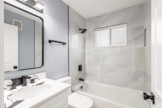 bathroom featuring shower / washtub combination, vanity, and toilet