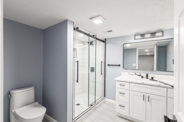 full bathroom featuring toilet, vanity, visible vents, marble finish floor, and a marble finish shower